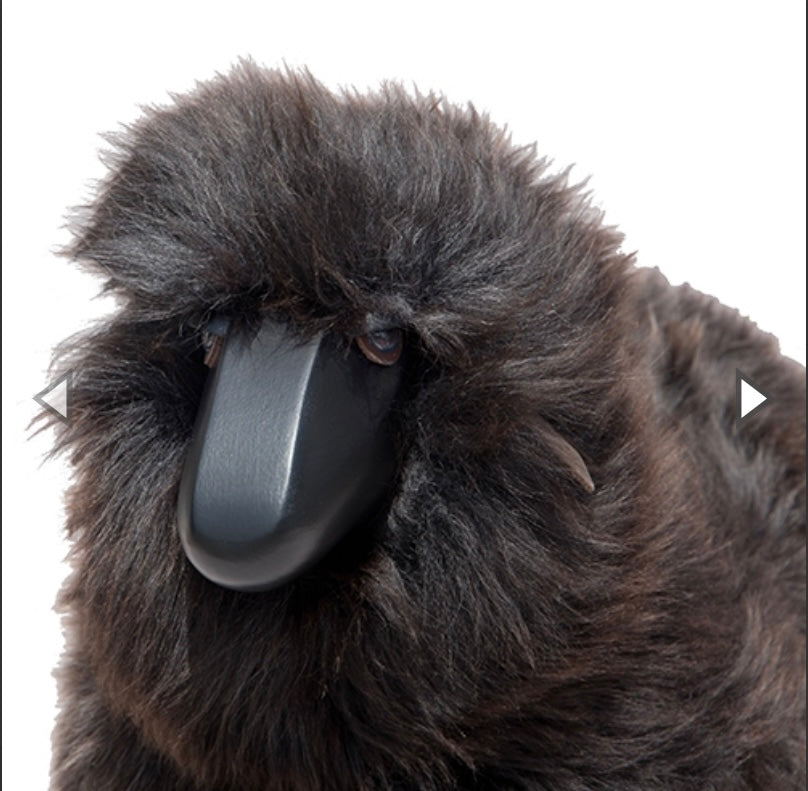 Lamm, graubraunes Fell, schwarzes Holz